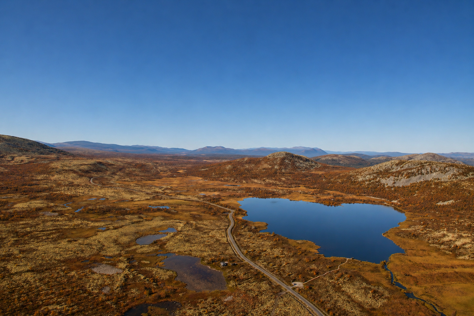 Aerial view of cabin and lake at Koppang